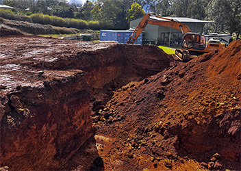 Excavator performing earthmoving work